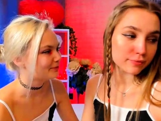 Redhead and blonde lesbians make out in a attractive manner