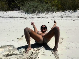 Busty babe playing with her large boobs