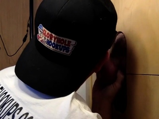 Gloryhole lover eagerly milking dicks via the wall