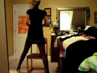 attractive babe strips out of red lingerie