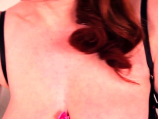 Redhead MILF Red XXX provides her pussy a massage