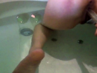 Chinese lesbians play a dildo in bathtub