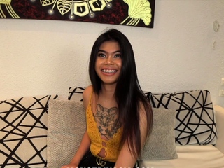 Young Thai girl with braces interviews for a maid job