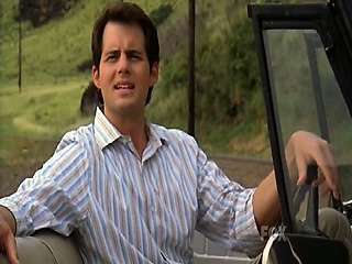 Amanda Righetti wearing a red top that shows off some