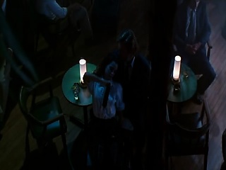 Mia Kirshner dancing for a guy at a strip club, wearing a