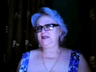 Russian granny ex-teacher flashing her big tits on  webcam