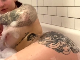 Busty curly brunette with big boobs fucks on couch