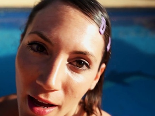 Hot brunette babe outdoors in her lingerie fingering herself