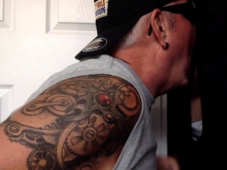 Mature DILF wanking dick while giving gloryhole blowjob