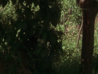 Tilda Swinton naked standing as a guy kisses and undresses