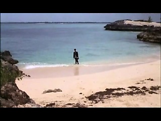 Daryl Hannah nude walking across some grass with her bare