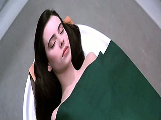 Mathilda May naked sitting up on a table, and then standing