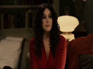 Monica Bellucci in a skimpy black dress that shows plenty