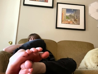 Brunette with foot fetish rubs big dick with her feet in POV
