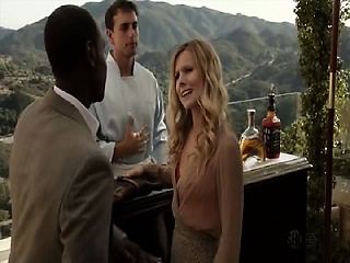 Kristen Bell making out with a guy while undressing and