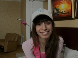 Sweet-looking teen spreads legs and fondles soaked pussy