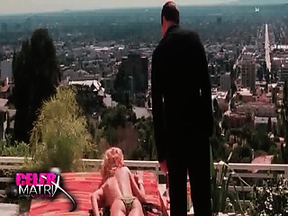 Uma Thurman lying face down topless and in yellow bikini