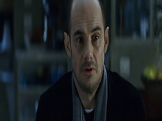 Monica Bellucci naked lying on her side in bed, twisting