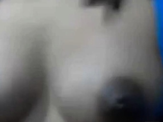 Squeezes out milk from her dark nip ttis