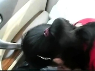 Asian older couple in the car