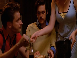 Diora Baird rolling over on top of a guy in bed, her