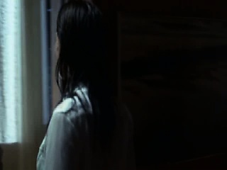 Jolene Blalock making out with a guy as they undress. We