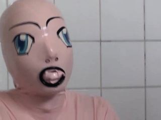 Tanja takes a bath in her latex sex doll costume
