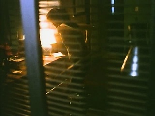 Courteney Cox making out with a guy as he lowers her white