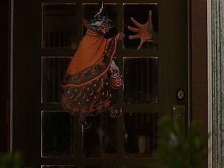 Jessica Alba showing cleavage while strapped to the top of