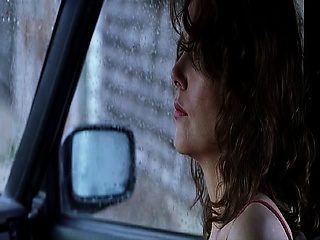 Nicole Kidman nude laying on a bed, her breasts visible as