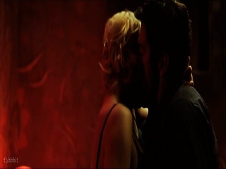 Alba Rohrwacher pulling her shirt off to reveal her bra