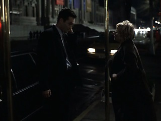 Anne Heche wearing a slightly see-through tanktop with no