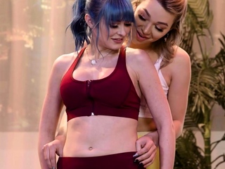 Busty yoga TS fucks colored hair babe during public class