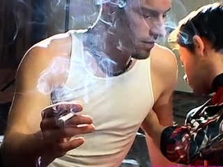 Gay dude with a cigarette in face hole enjoys slavery sex