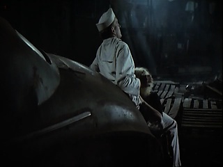 Jennifer Jason Leigh going topless at a bar, stumbling