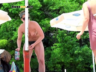 One gorgeous hot nude beach girl gets joined by her friend