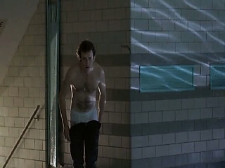 Daryl Hannah making out with a guy in a boiler room as he