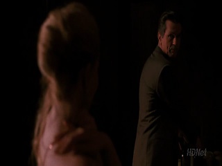 Drew Barrymore making out with a guy on the hood of a car