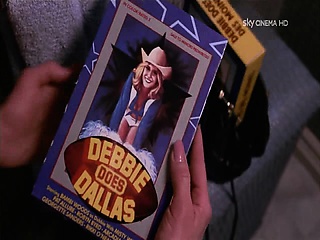 Kim Basinger in a white slip with hard nipples as she poses