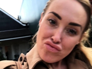 Outdoor solo masturbation scene with curly blonde