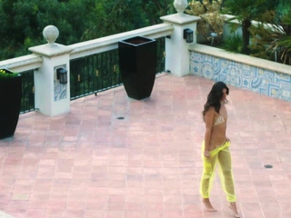 Petite latina MILF dips naked in a pool