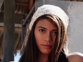 Petite naked exotic muse posing outdoor