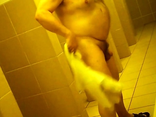 Naked men in public pool shower