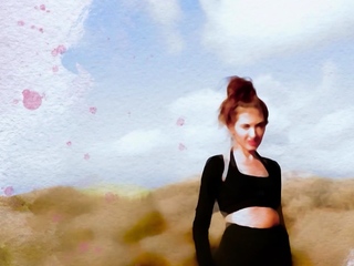 Sexy muse reveals her tits in the desert