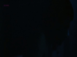 Asia Argento making out with a guy as he undresses her on a