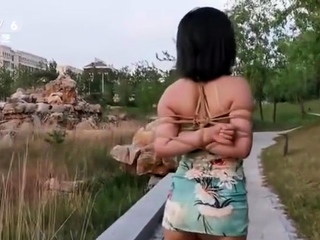 Asian amateur gives an outdoor blowjob
