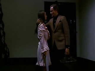 Christina Lindberg lying nude on a bed with Despina