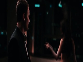 Paz Vega in the back seat of a limo as a guy turns her