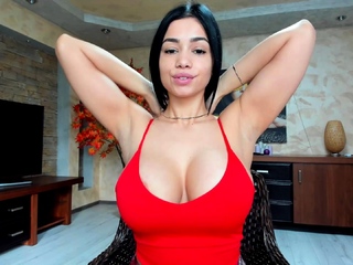 Busty curly brunette with big boobs fucks on couch