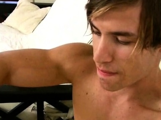 Hot muscled tanned gay hunk taking a shower